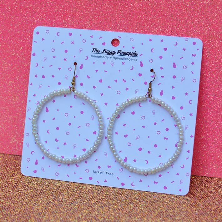 White Pearlescent Seed Bead Hoop Earrings for wholesale by The Fuzzy Pineapple