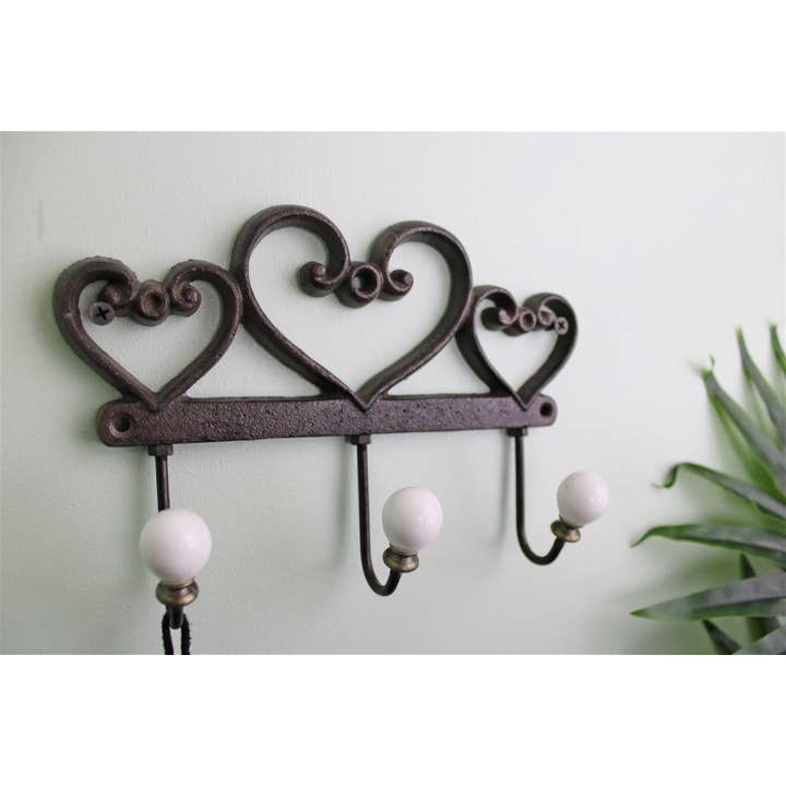 Brown Rustic Cast Iron Wall Hooks, Hearts for wholesale on Faire