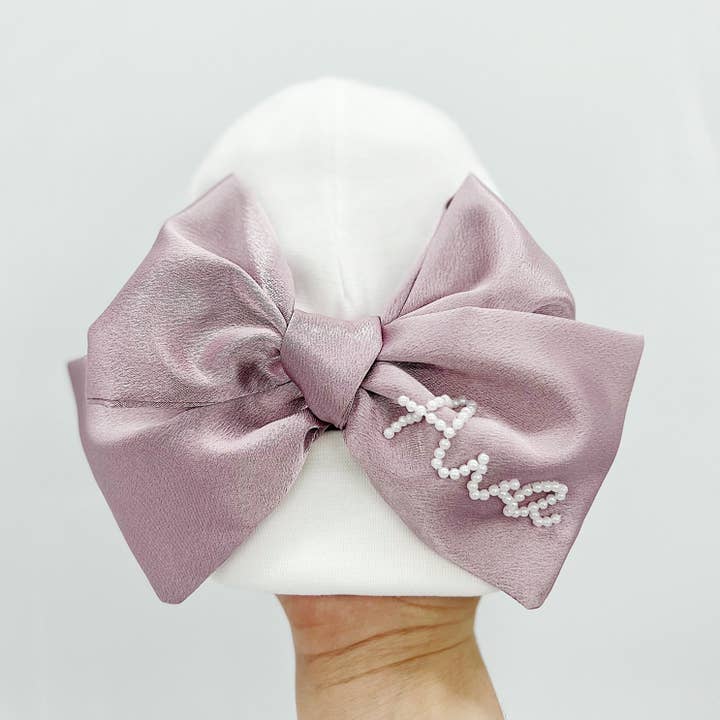 Newborn Hat With Lavendar Bow for wholesale by Bebe Theory