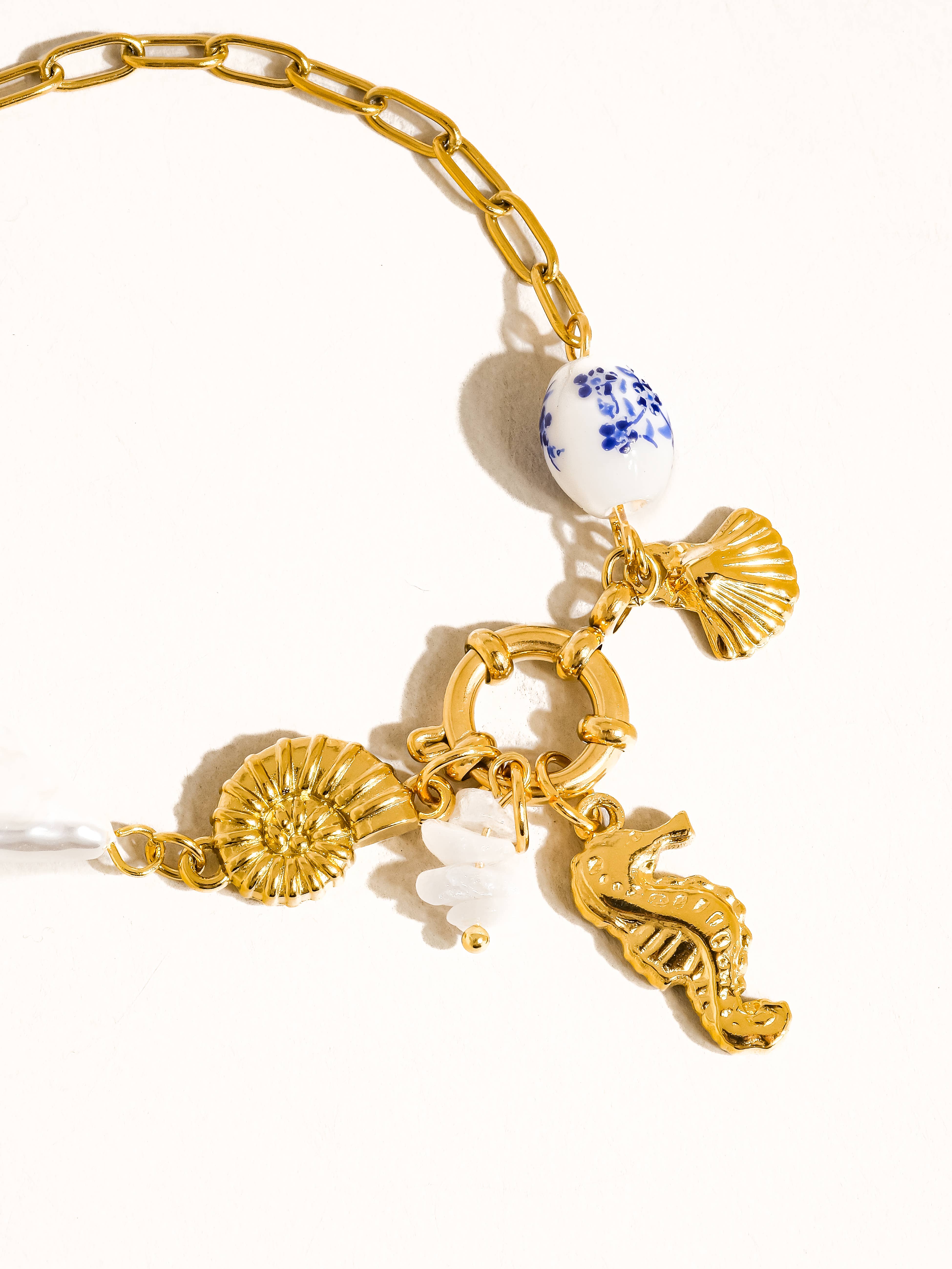 Cecily 18K Gold Non-Tarnish Seahorse Seashell Charm Bracelet for wholesale on Faire1