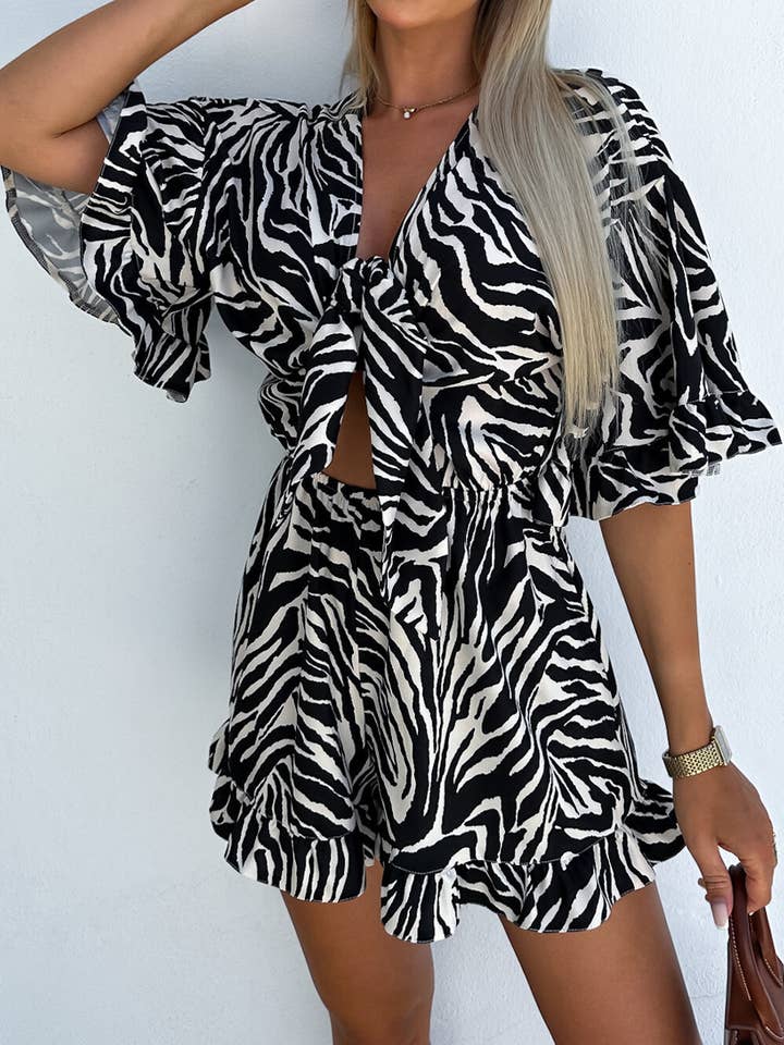 Lily Clothing - Wholesale Romper - Women's - Zebra-print rotator cuff V-neck lace-up rompers
