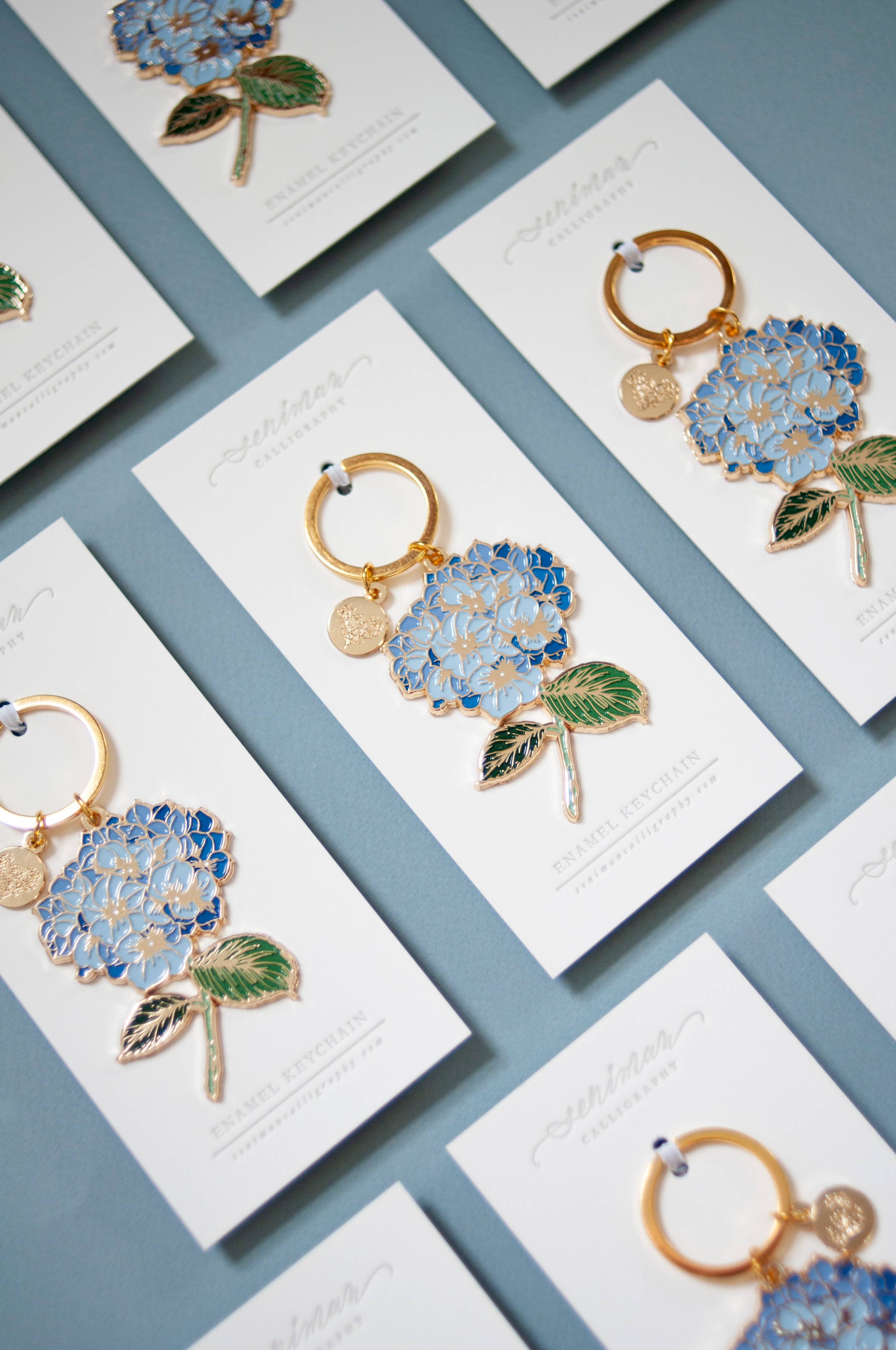 Seniman Calligraphy - Wholesale Keychain - Women's - Blue Hydrangea Gold Soft Enamel Key Chain1