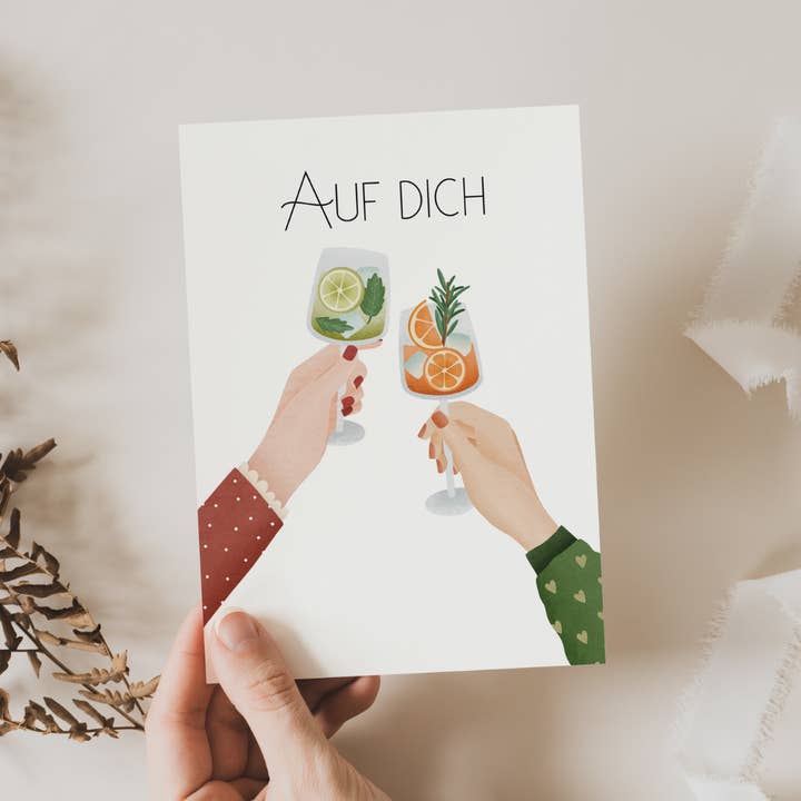 Postcard Toasting “Auf Dich” Drinks New Year's Eve/Birthday for wholesale by Tilda&Theo