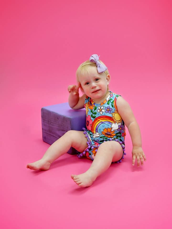 Rainbows and Sunshine Milk Silk Pom Pom Romper for wholesale by Great Lakes Kids Apparel
