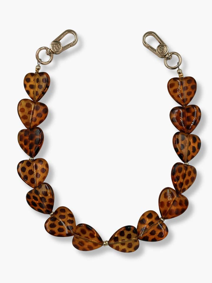 Pochette de poignet pour téléphone Leo Heart pour la vente par THE CÆP