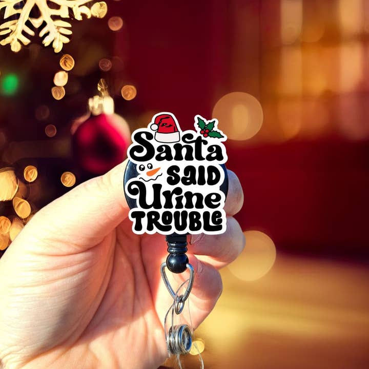 Santa said Urine Trouble Christmas Badge Reel for wholesale by The Badge Boutique CO