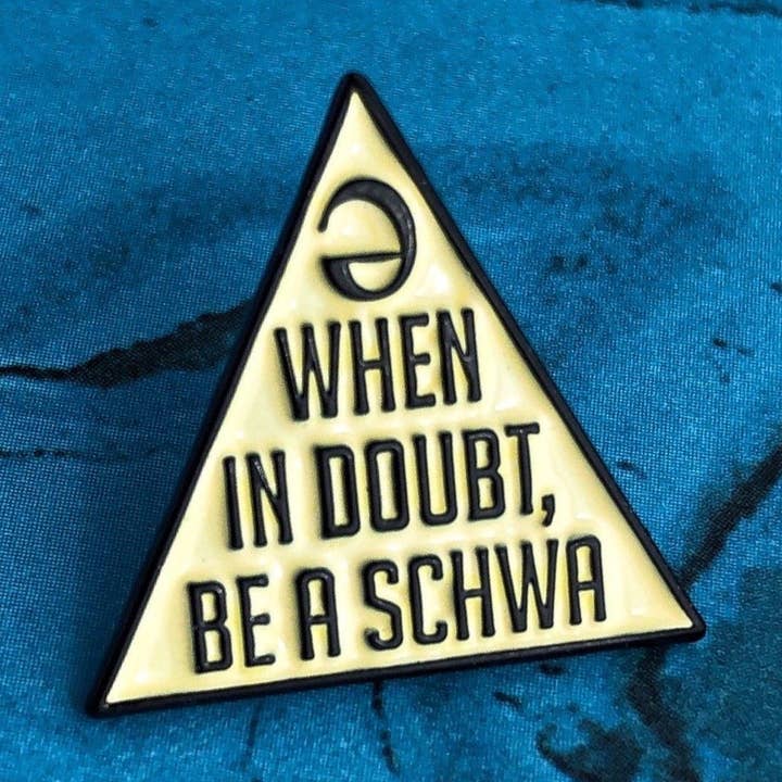 Never Stressed Schwa Pin for wholesale by Rad Girl Creations