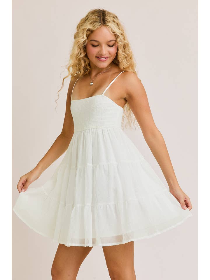 White SMOCKED TIERED MINI DRESS for wholesale on Faire