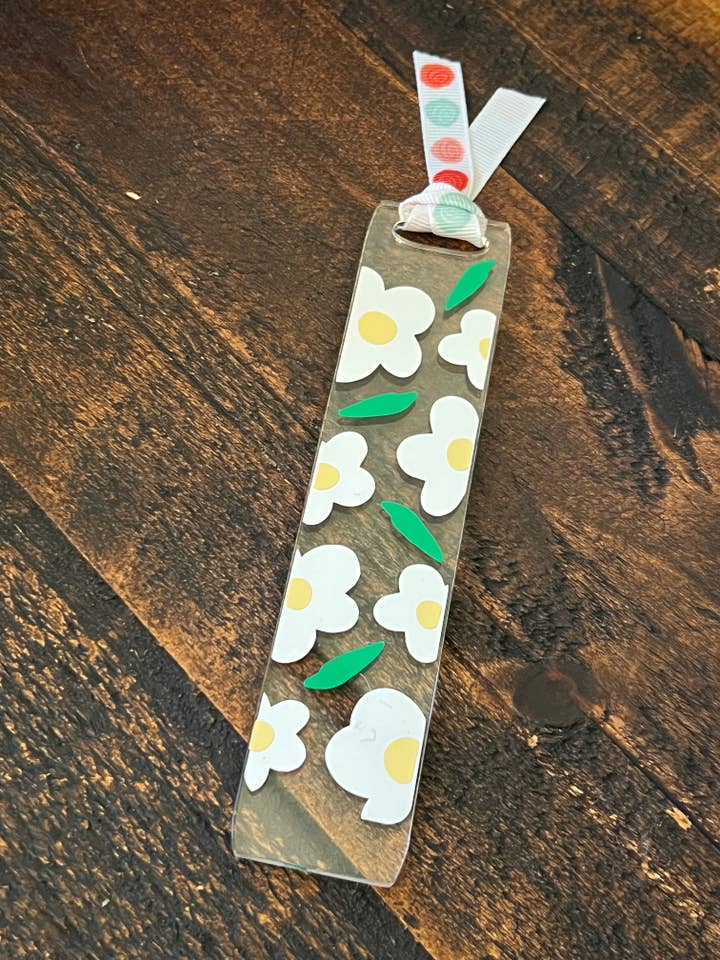 Witte boekenlegger van acryl met madeliefje voor wholesale door Suchfungoods