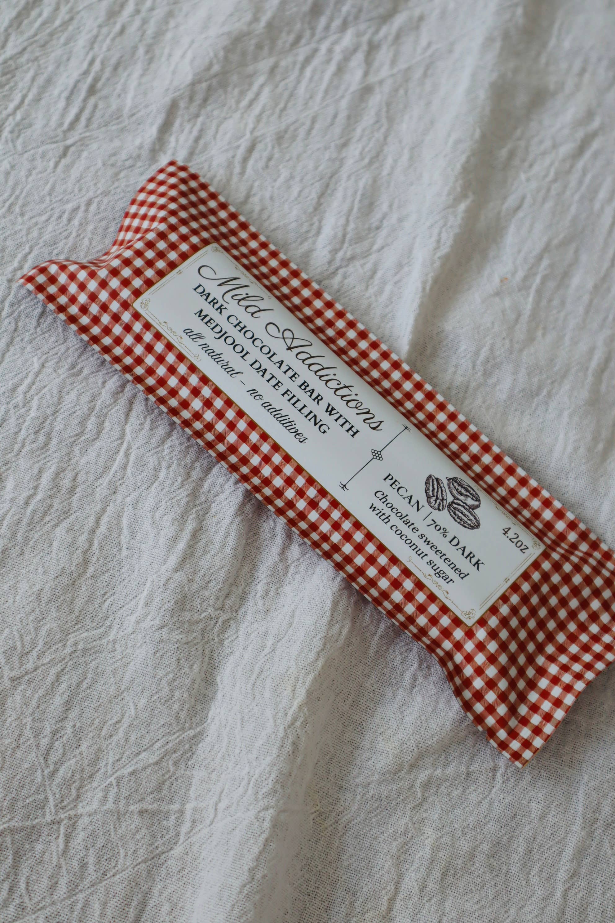 Mild Addictions – wholesale Chocolate bar – Dark Chocolate Bar with Pecan & Medjool Date Center — 4.2oz1