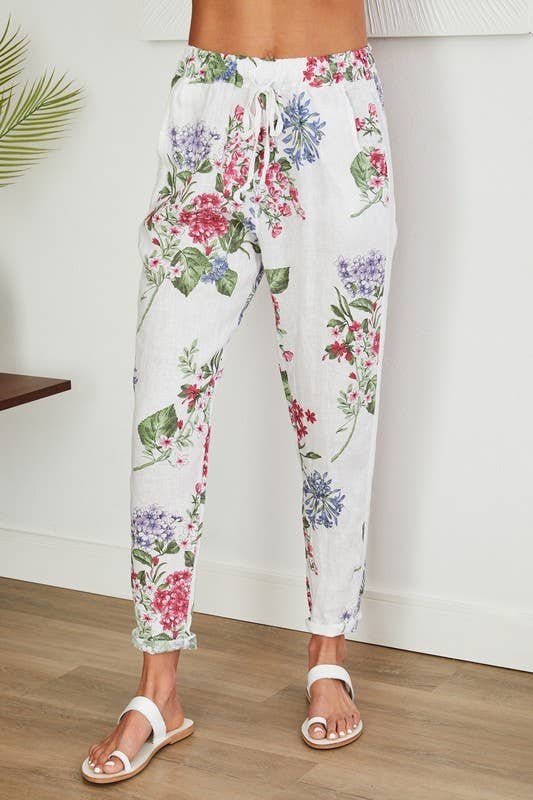 Wit LINNEN BROEK MET BLOEMENPRINT EN PAILLETTEN ZIJSTREEP (16-08-FLORAL) voor groothandel op Faire0