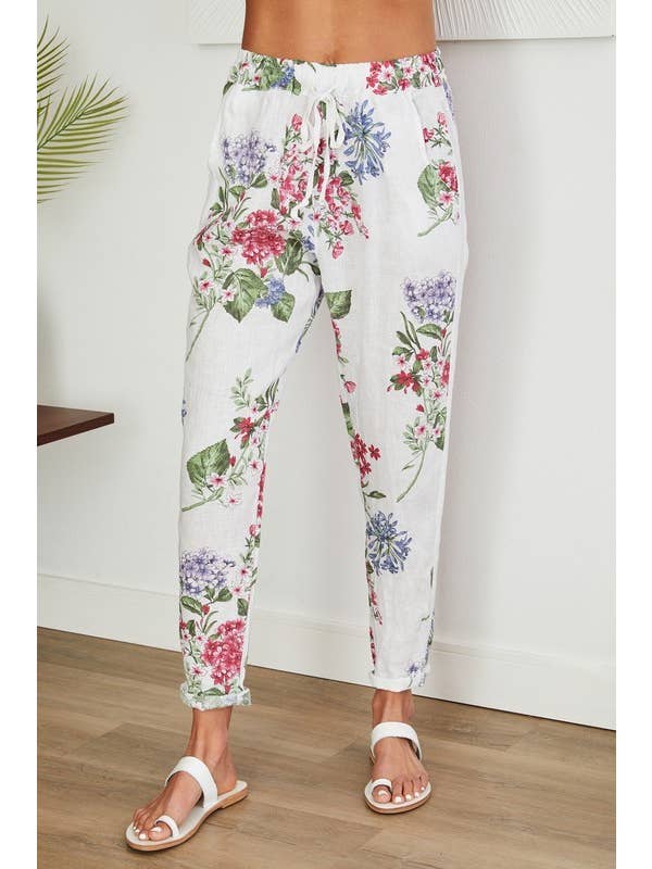 Wit LINNEN BROEK MET BLOEMENPRINT EN PAILLETTEN ZIJSTREEP (16-08-FLORAL) voor groothandel op Faire