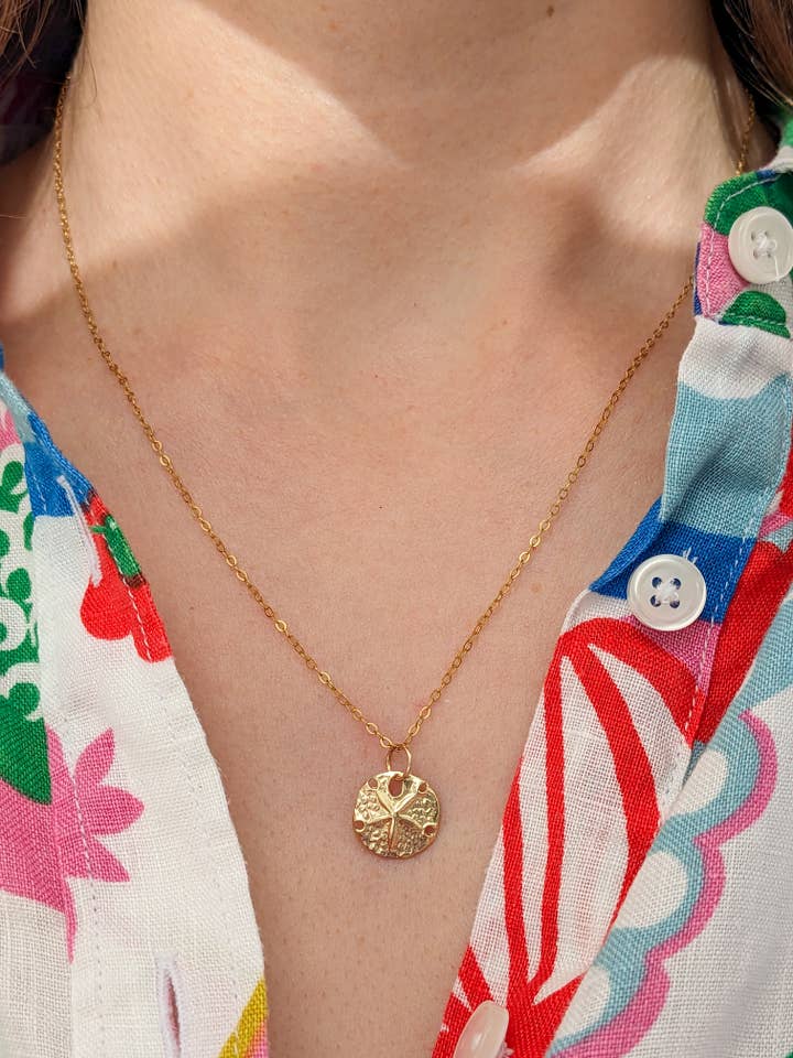 Gold Sand Dollar Necklace for wholesale by Freya Adventure Awaits