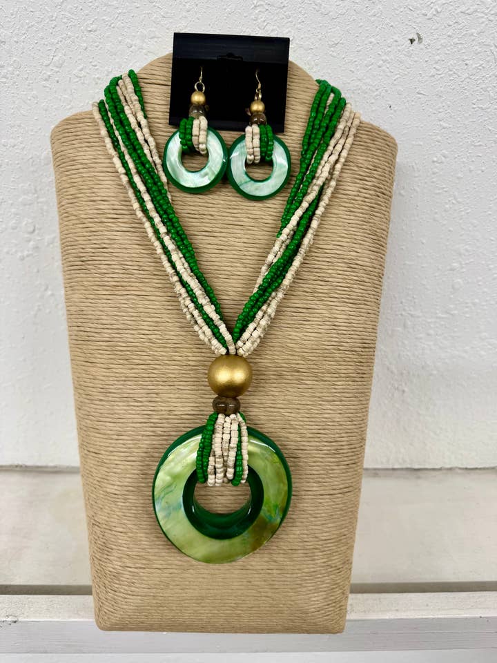 10 STRANDS GREEN AND NATURAL WHITE COCONUT WOOD BEADS WITH G for wholesale by International Duru's