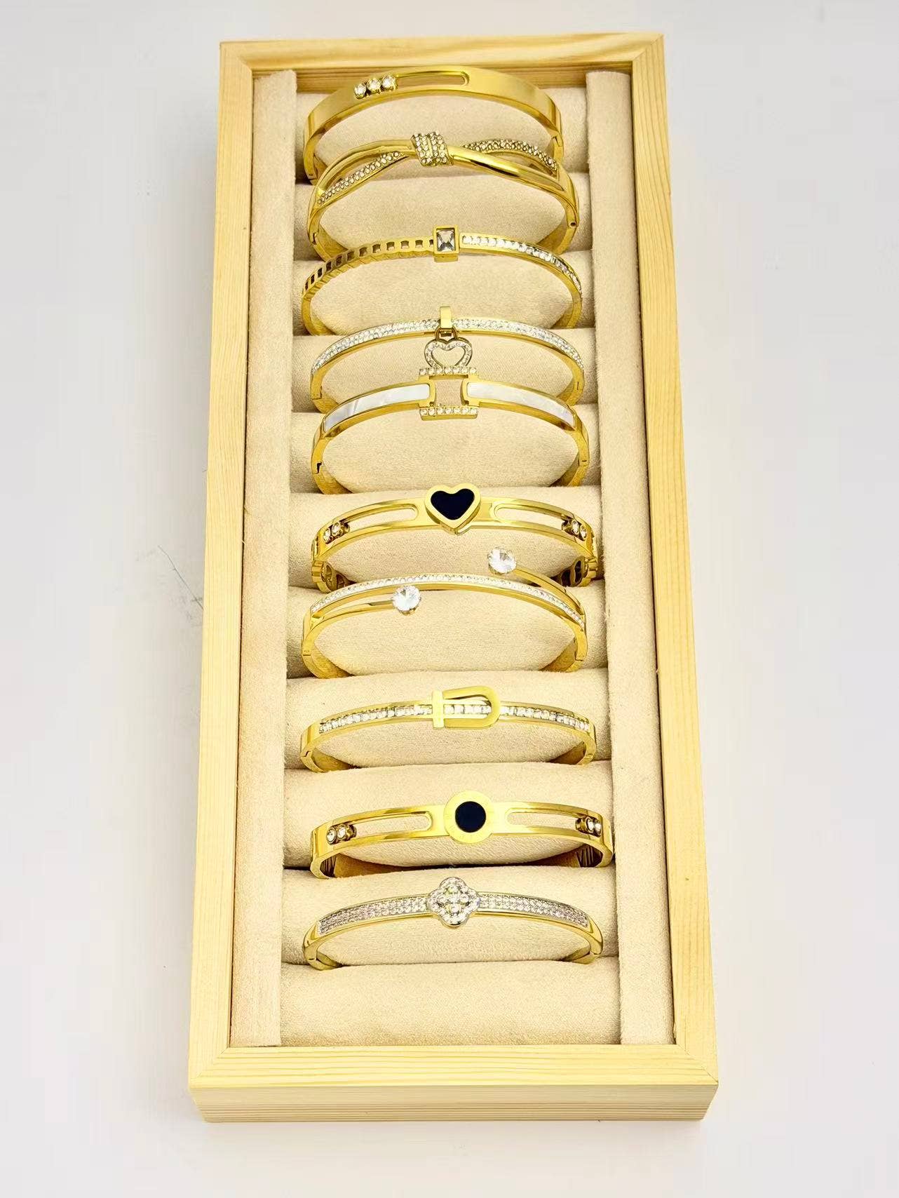 COSMOS - Wholesale Jewelry Set - Set of 10 elegant stainless steel bracelets on display1