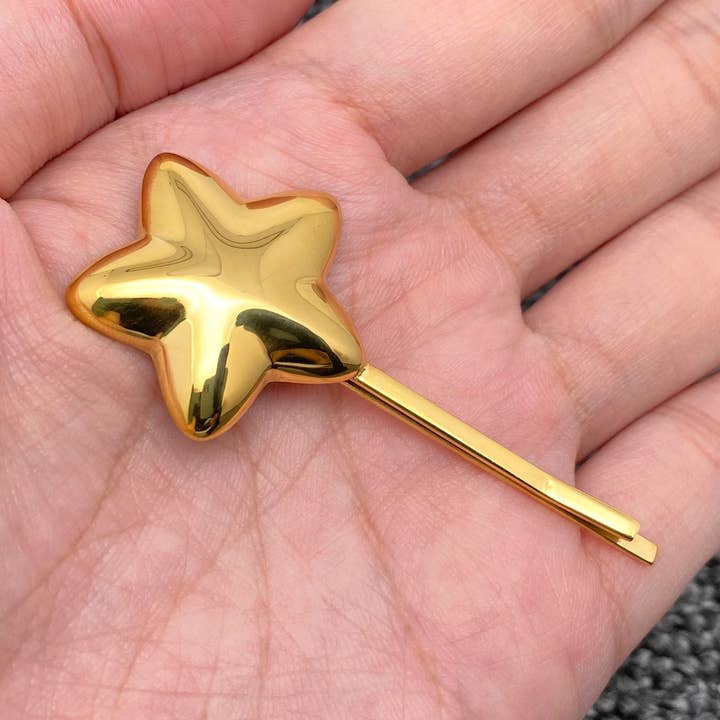 Glossy Star 18K Gold Plated Stainless Steel Hairpin - FGS and other Purchase Wholesale gold star pins. Free Returns & Net 60 Terms on Faire trending on Faire.