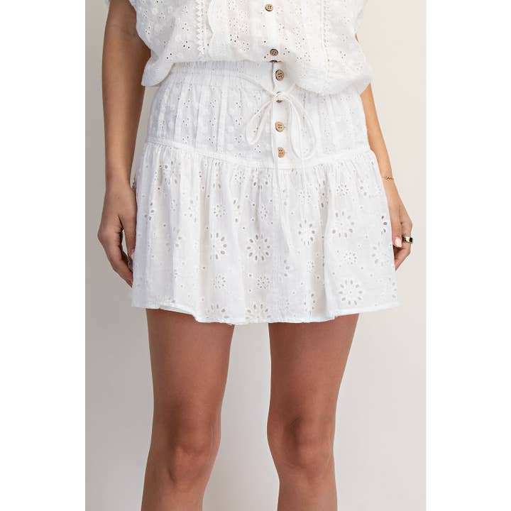 MINI-JUPE-SHORT À ŒILLETS pour la vente par COTIERRA