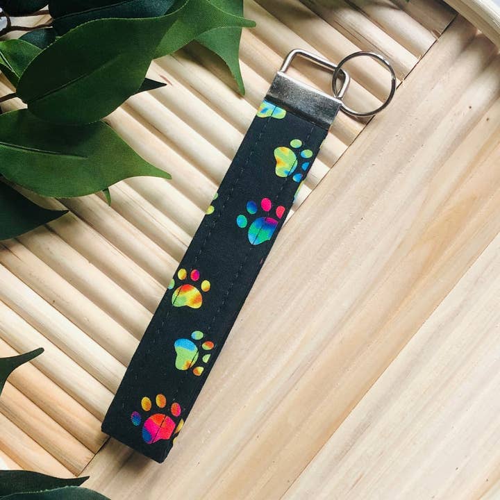 Black and Rainbow Tie Dye Paw Print Fabric Wristlet Keychain, Key Fob for wholesale by MDStickerShop