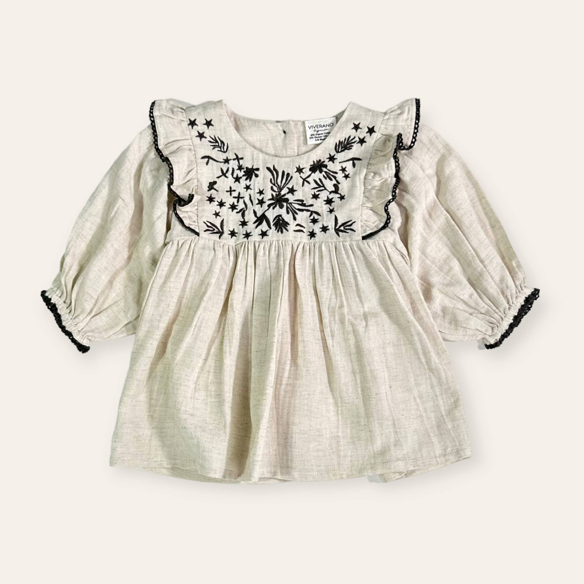 Natural Heather Embroidered Ruffle Flare Baby Dress (Organic Cotton / Linen) for wholesale on Faire1