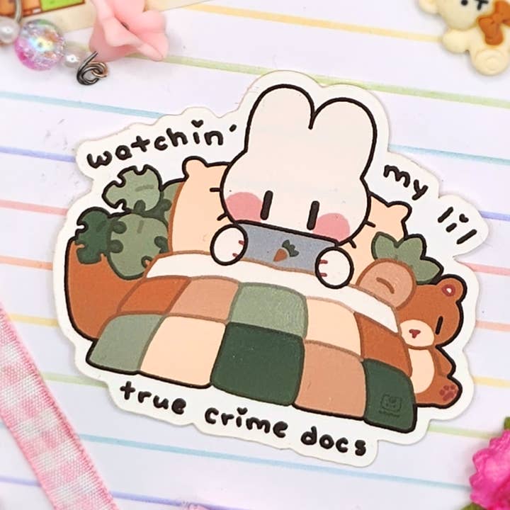 Comfy Cozy Crime Enjoyer 3in Vinyl Sticker for wholesale by mirupiico