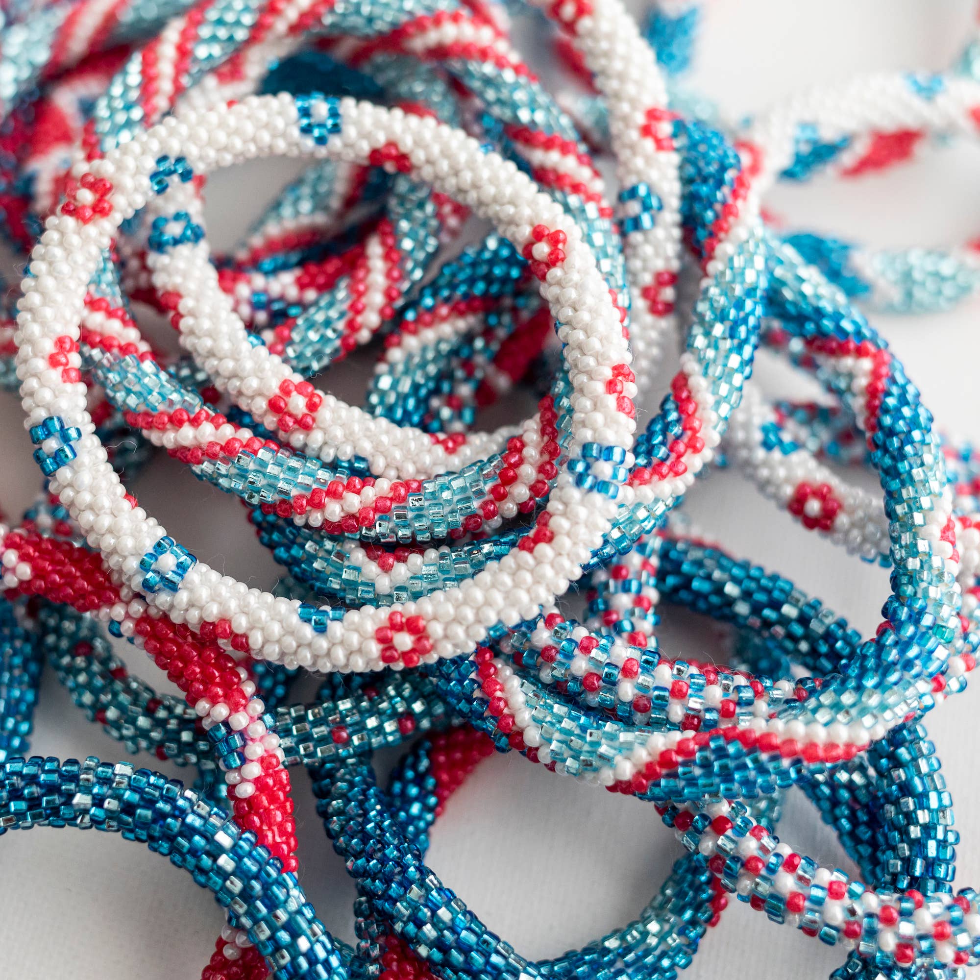 Aid Through Trade - Wholesale Jewelry Set - The Original Roll-On® Bracelet Firecracker - Set of 122