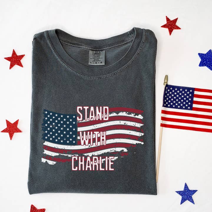 Flag Stand With Charlie Unisex Comfort Colors Tee for wholesale by God And Glory Gifts