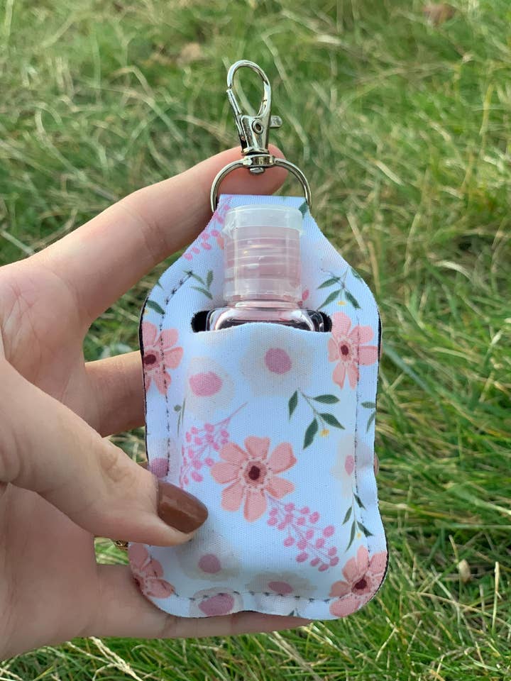 Pastellfärgad blomhållare för handdesinfektion med nyckelring för wholesale av The E Tribe Co.