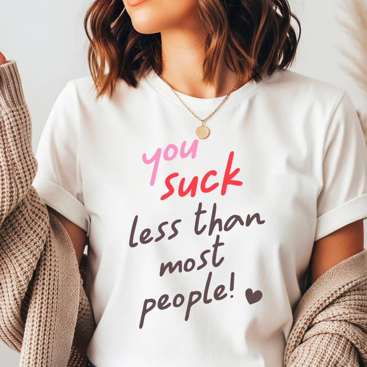 Valentine's Day Gift for Her, You Suck Less Graphic Tee for wholesale by M.B. Paper Design