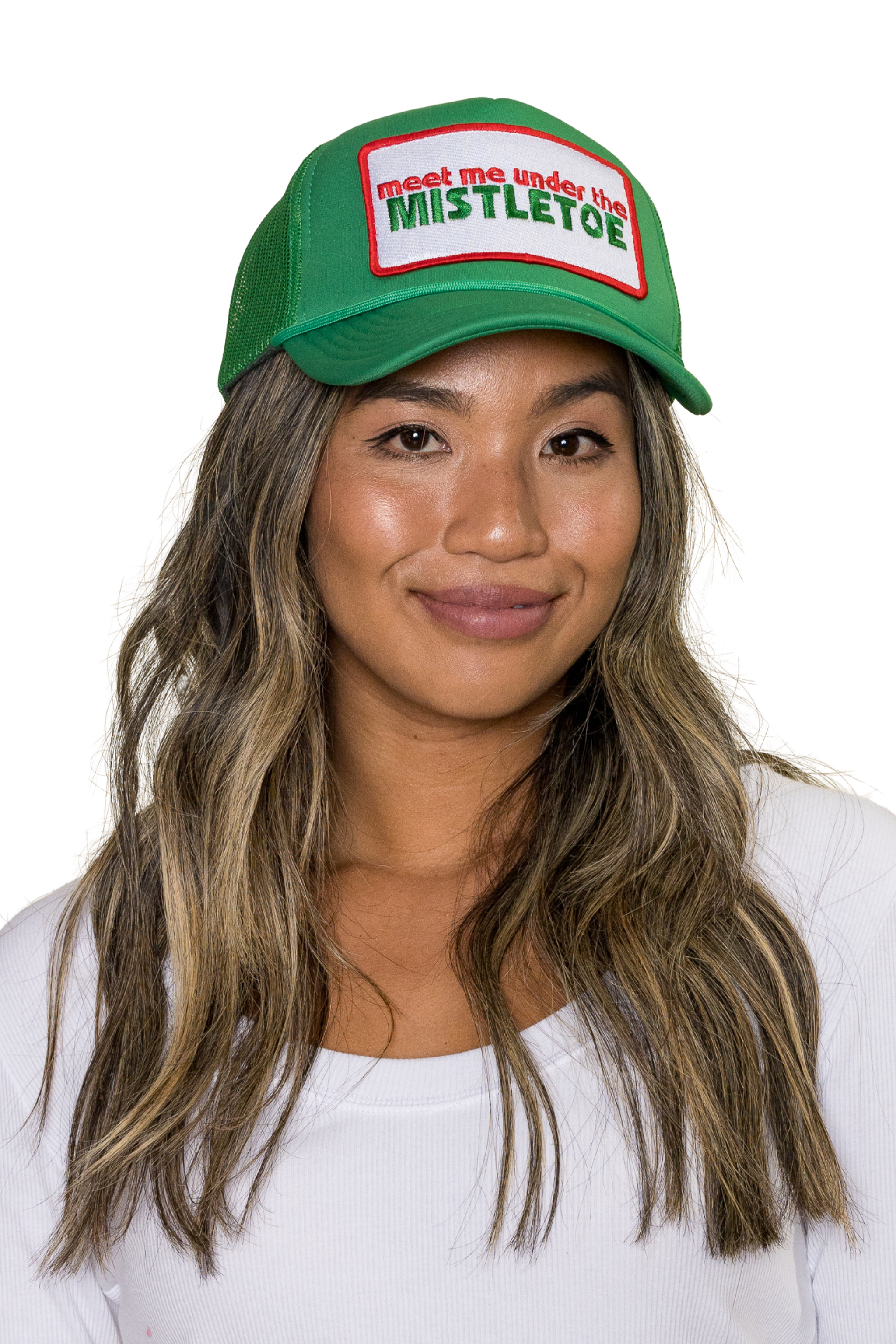 Meet Me Under The Mistletoe Trucker Hat in Green for wholesale on Faire1