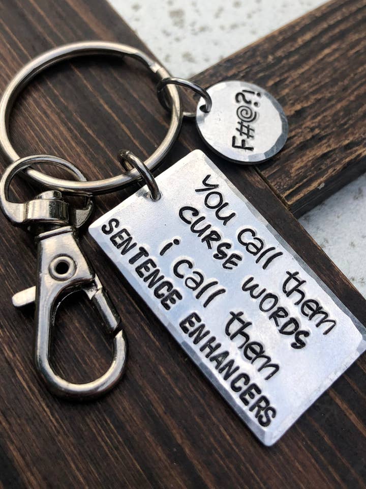 ”Mening Enhancers” nyckelring för wholesale av The Imprint Duo