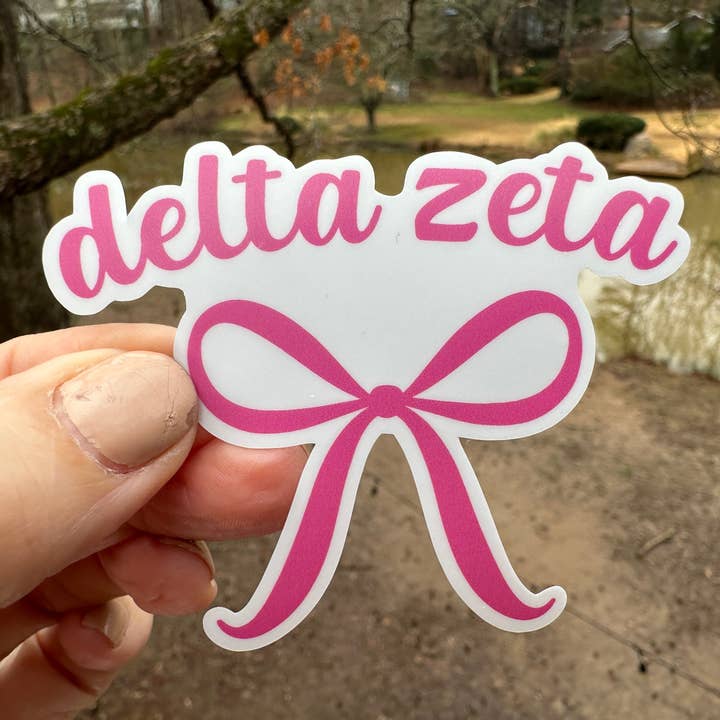 Sticker | DZ | Delta Zeta Pink Bow | Waterproof Vinyl Sticker | White | Clear | Permanent | Removable | Window Cling | Glitter | Holographic for wholesale by My Vinyl Cut