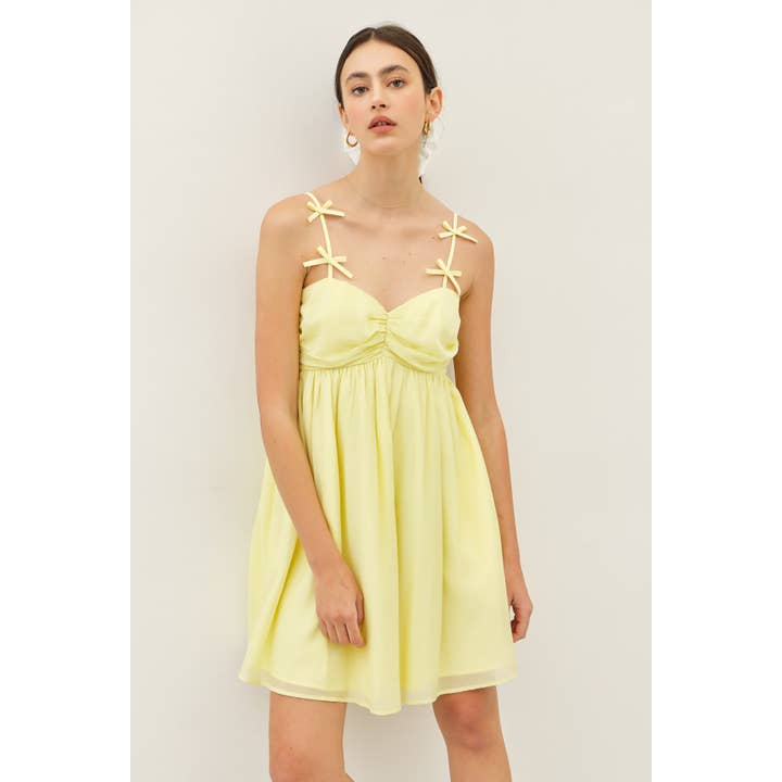 MINI ABITO BABYDOLL IN TESSUTO TESTURIZZATO CON DETTAGLIO FIOCCO per la vendita all'ingrosso da parte di idem ditto