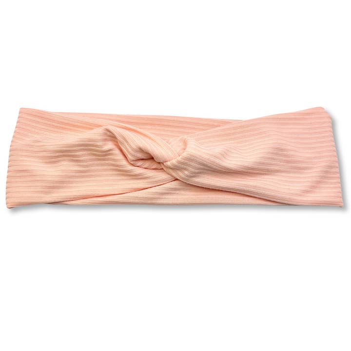 Lyserød ribbet pandebånd med knude i twist-design for engroshandel hos Enchanted Scrunch