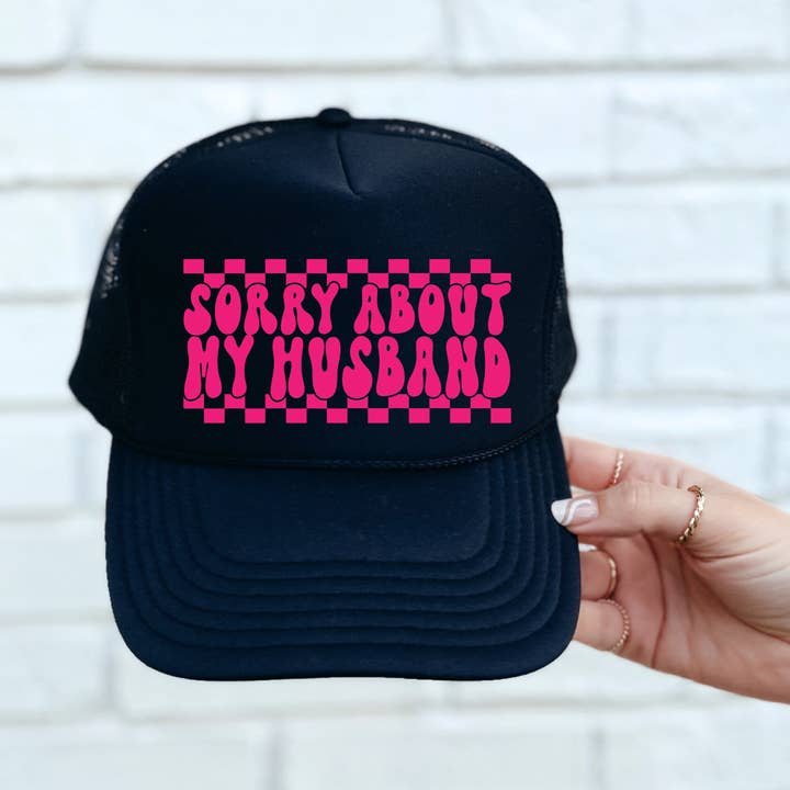 Sorry About My Husband DTF Printed Black Trucker Hat/Pink Text for wholesale by Southern Attitude Designs Inc