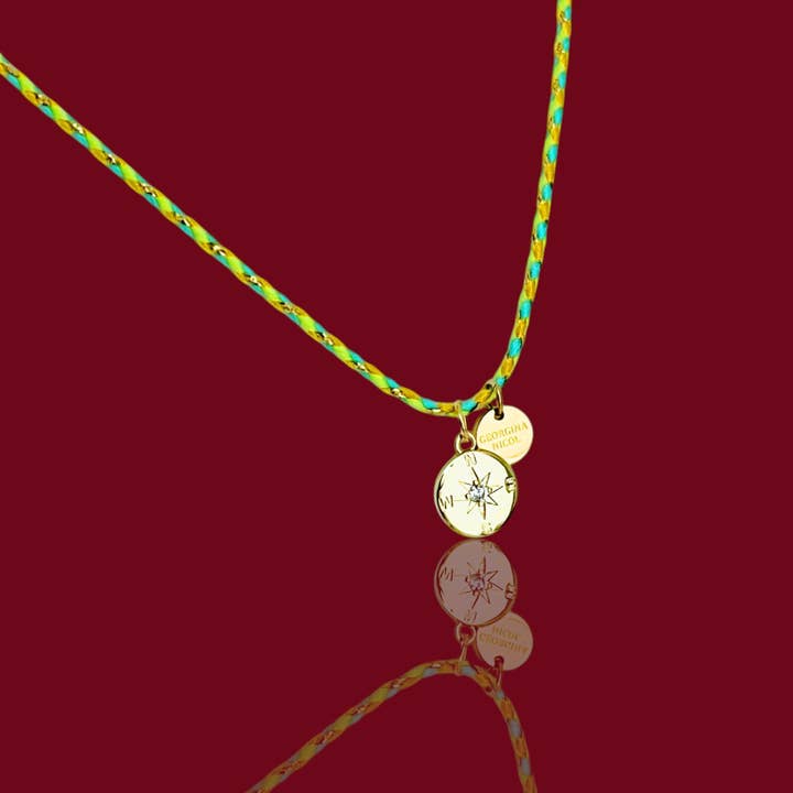 Guidance & Adventure – Gold Compass Pendant on Braided Cord for wholesale by Georgina Nicol