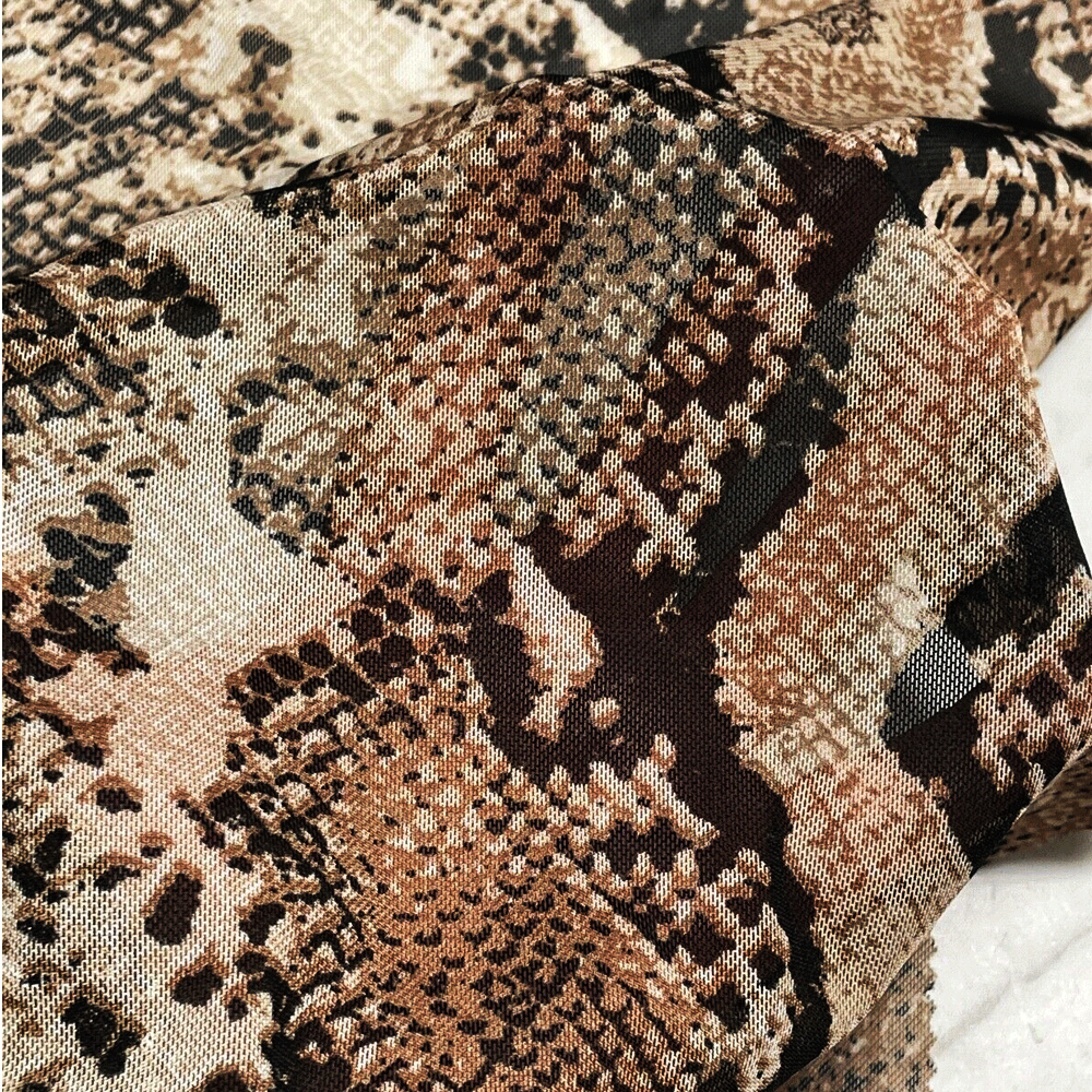 WeBaG N WeCoveR - Vente Tissu - Tissu Power Mesh imprimé en peau de serpent transparente3