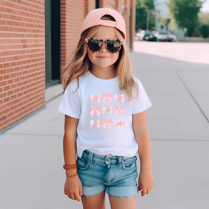 Chemisier à nœuds et nœuds pour enfants Coquette pour la vente par The Landing @ Fusion