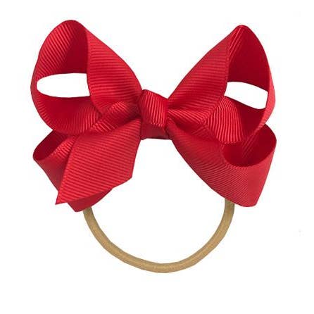 Maxima hair bow with elastic band in red for wholesale by La Fillette Accessories