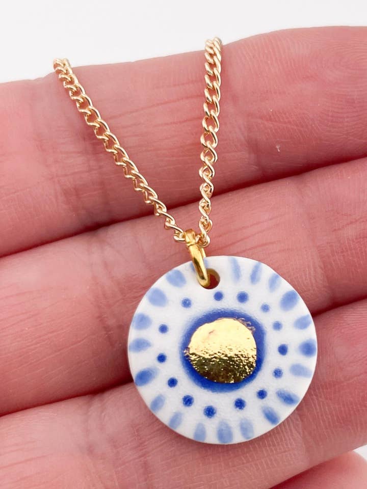 Hand Painted Dark Blue Dot Pendant necklace with gold centre for wholesale by Clay Blanca