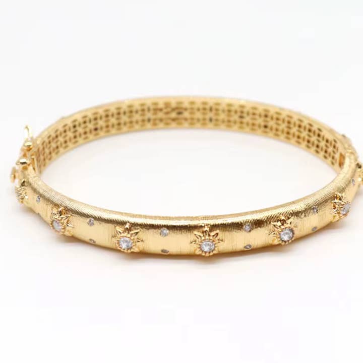Opera Bracelet the Marci Open Hinge CZ Wrap 18K Gold Bangle and other Purchase Wholesale cz bangles. Free Returns & Net 60 Terms on Faire trending on Faire.
