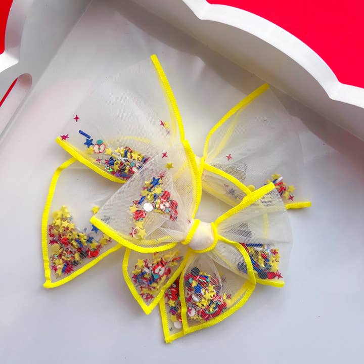 A+ Shaker Bow for wholesale by Sparkling New Baby, LLC.