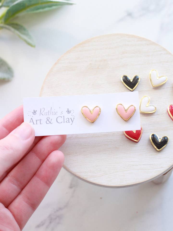 Gold Trimmed Heart Studs for wholesale by Ruthie and Co.