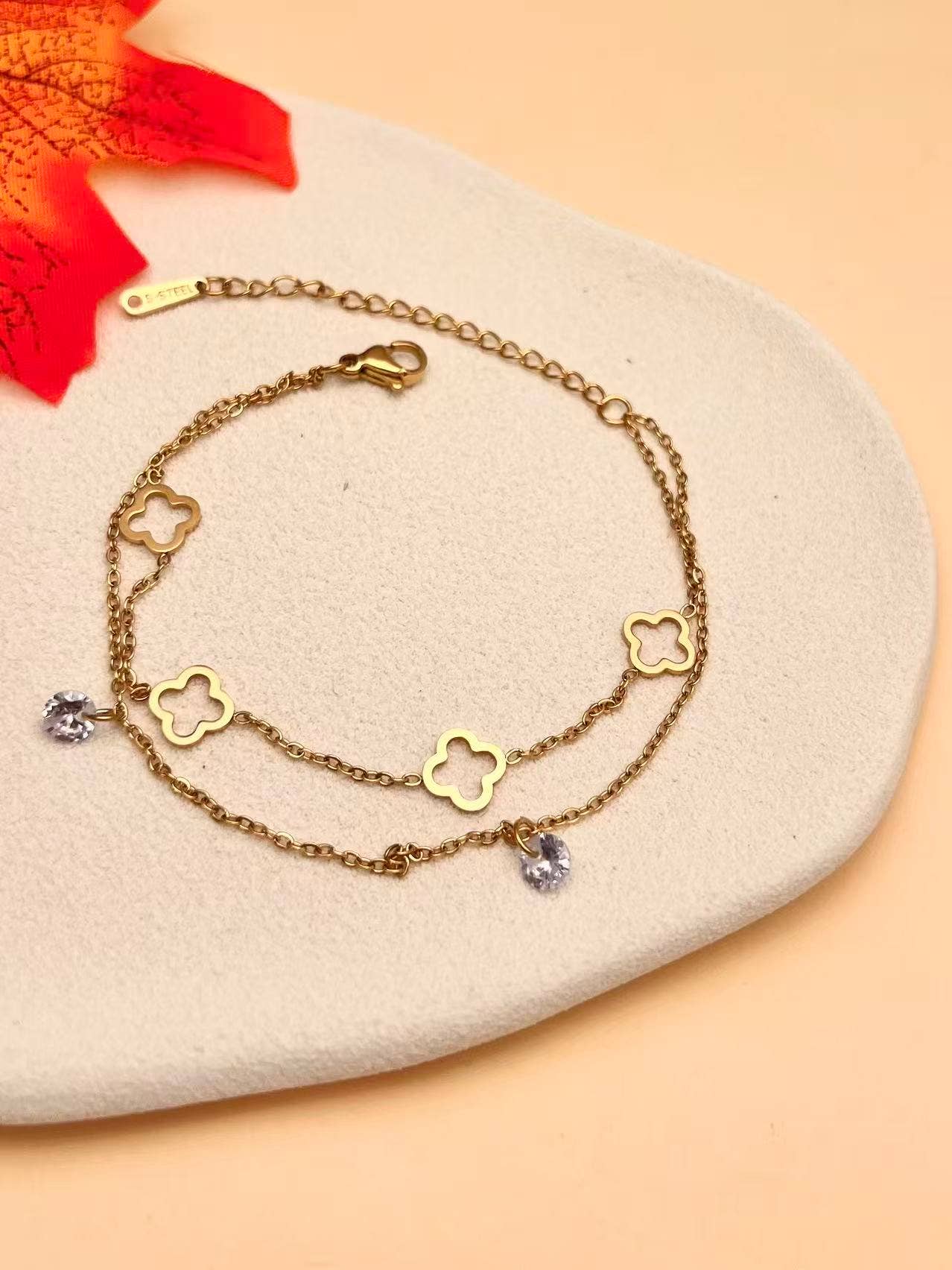 COSMOS - Wholesale Charm/Dangle Bracelet - Double Chain Gold Bracelet with Clovers and Gemstones0