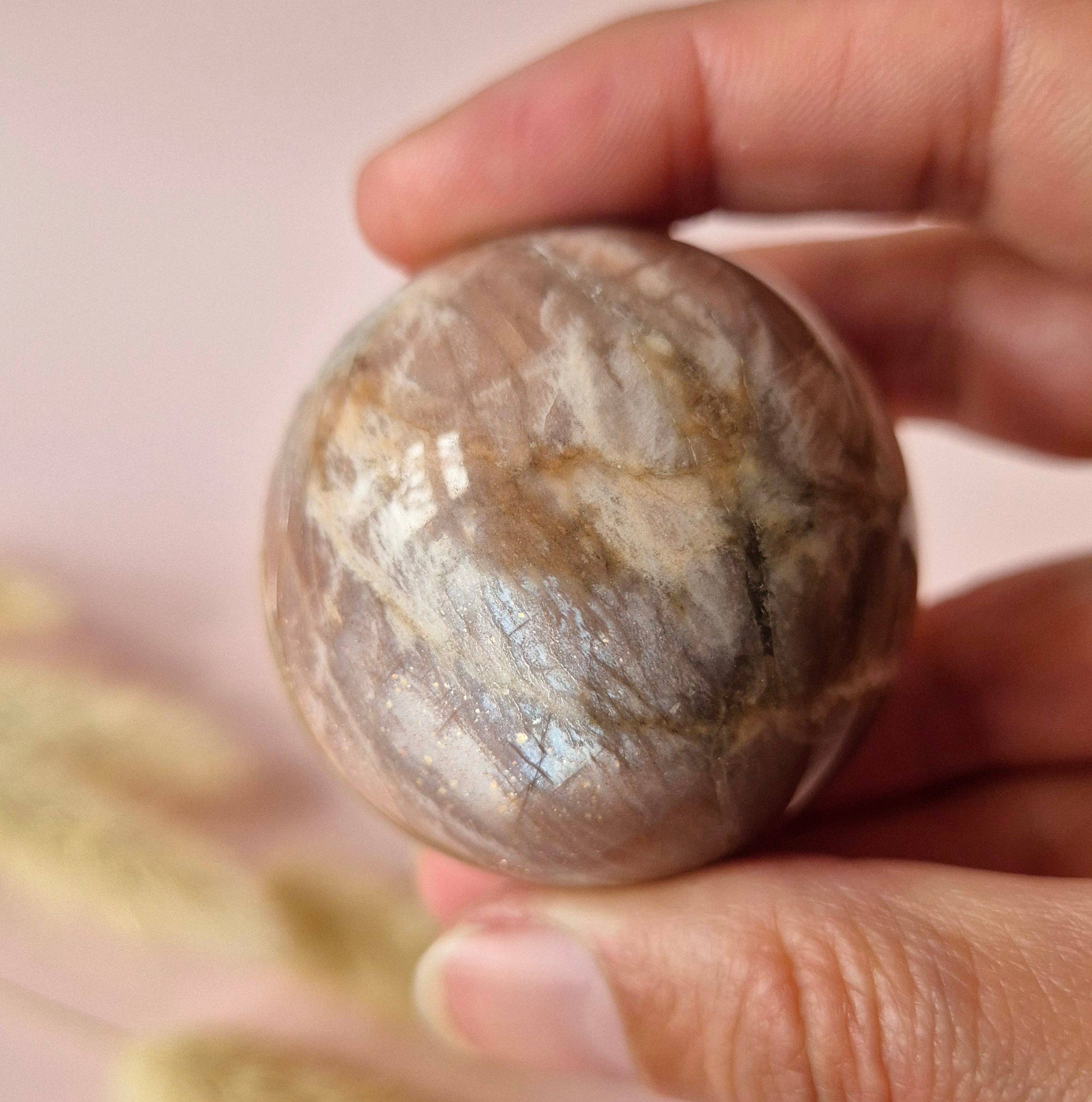 Moonlight Gemstones - Wholesale Spiritual Stone/Crystal - Crystal Gemstone Golden Sunstone Sphere with Blue & Gold Flash | 45–63 mm sphere0