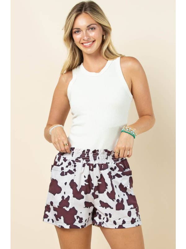 Brown Cream AP1312-MARGOT COW PRINT SMOCK ELASTIC WAIST WOVEN SHORTS for wholesale on Faire10