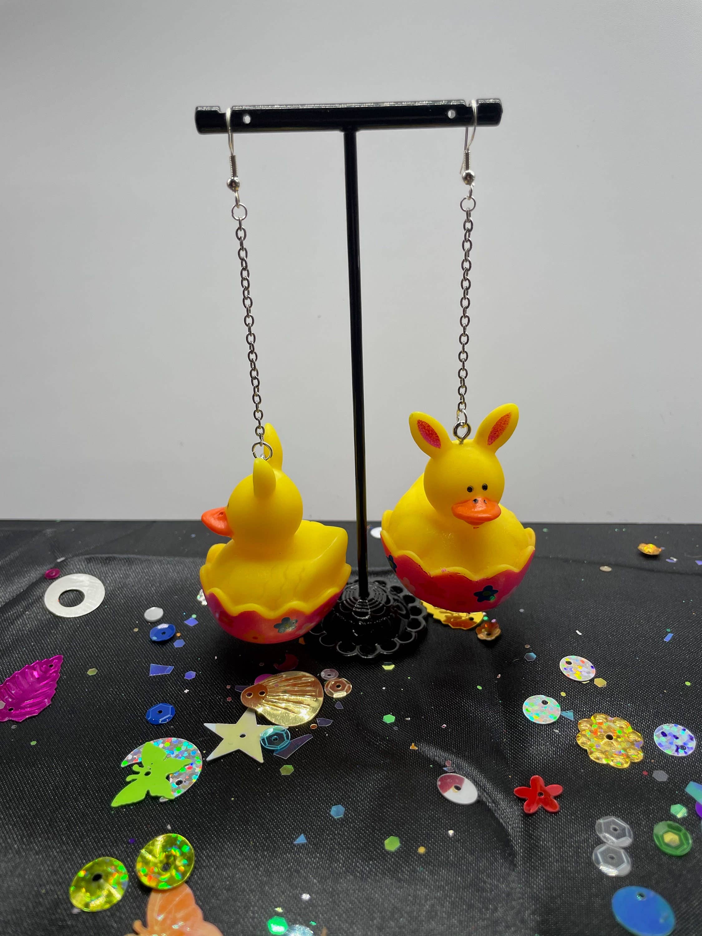 R59Creates – wholesale Dangle earrings – Easter Themed Lil Rubber Ducky Earrings! In Yellow Bunny, Blue Bunny, Pink Bonnet, And Purple Egg W/ Gold, Silver Or Silver Drop Chain!2