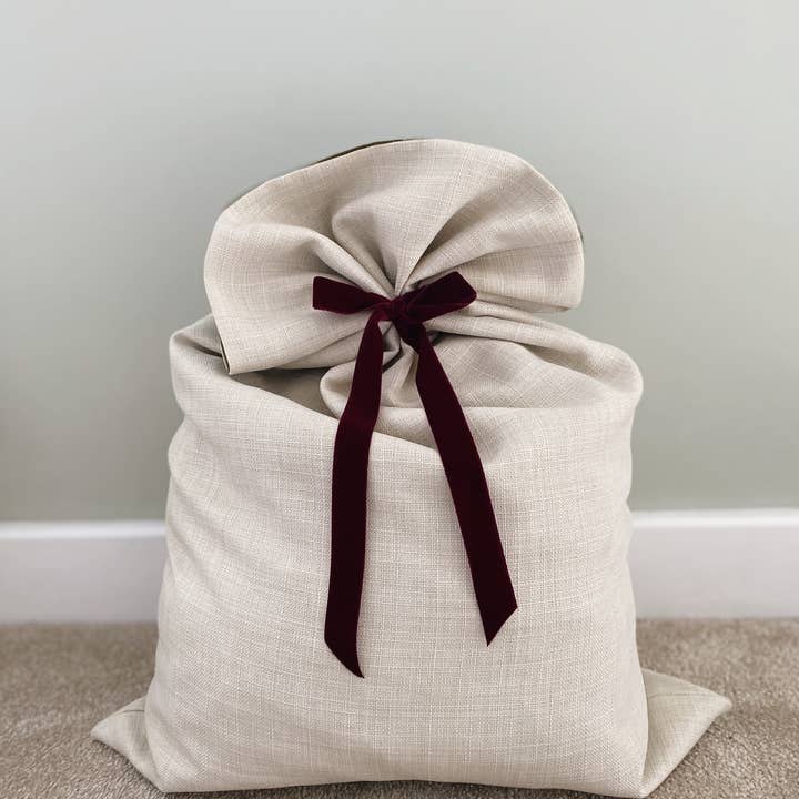 Cream Linen Textured Velvet-Lined Christmas Santa Sack and other Purchase Wholesale christmas sack. Free Returns & Net 60 Terms on Faire trending on Faire.