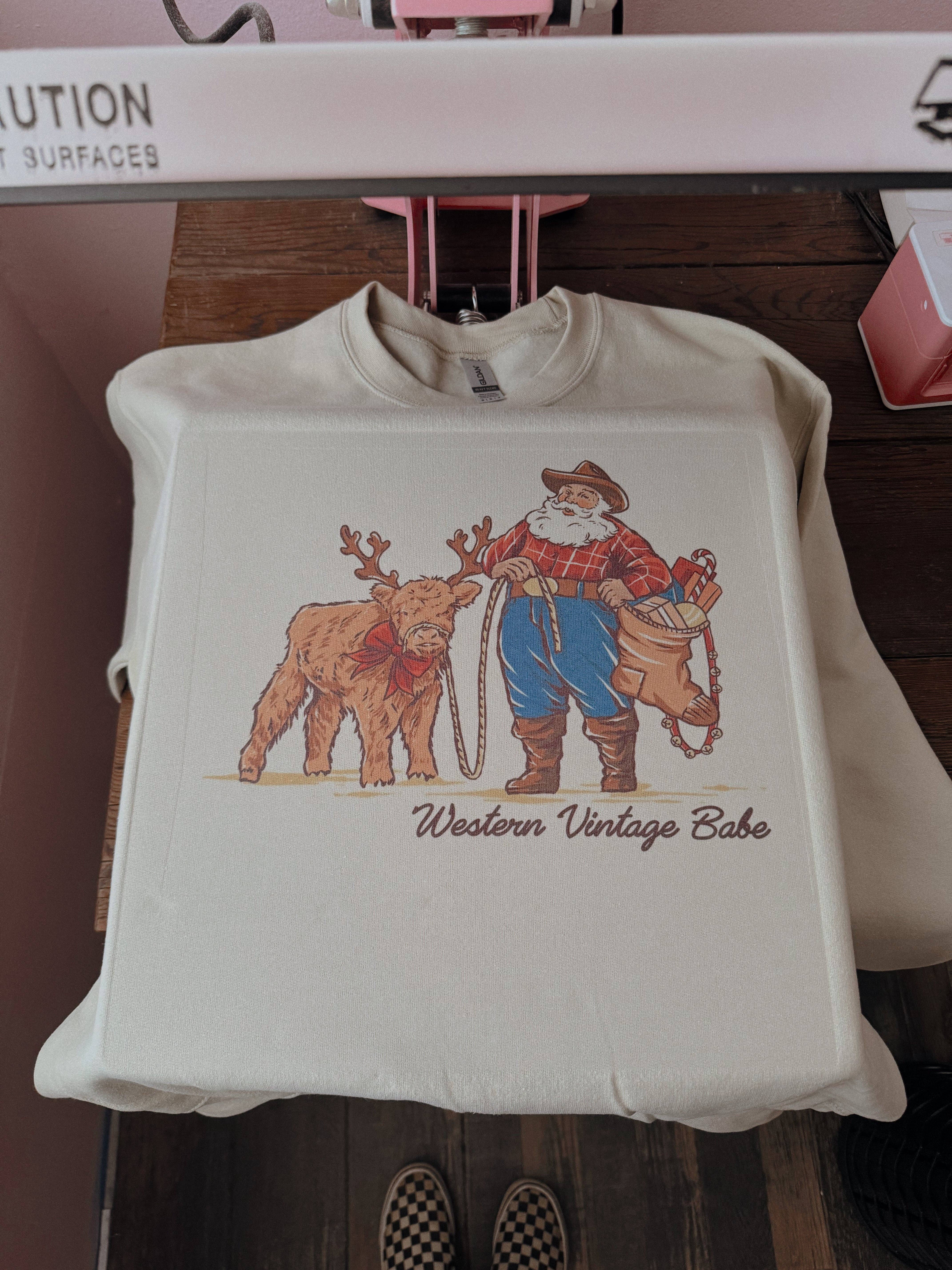 Western Vintage Babe - Vendita all'ingrosso Maglietta stampata - Unisex - BABBO NATALE MI HA COMPRATO UNA MUCCA DELLE HIGHLAND1