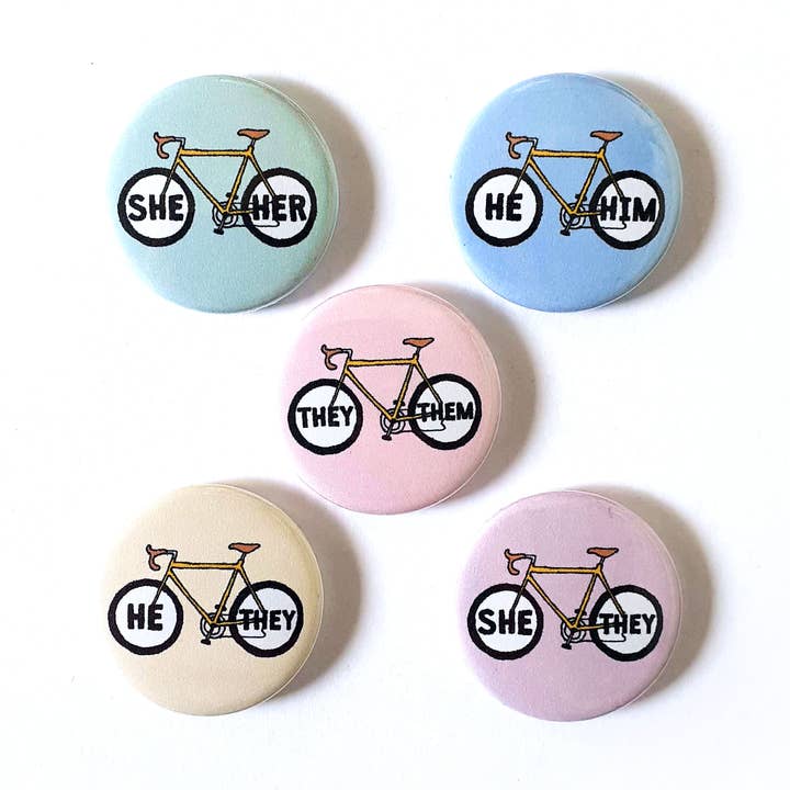 Mini 25mm Bicycles Pronoun Pin Badges on Cute Display Card for wholesale by O What A Feeling | Textile & Paper Goods Co.