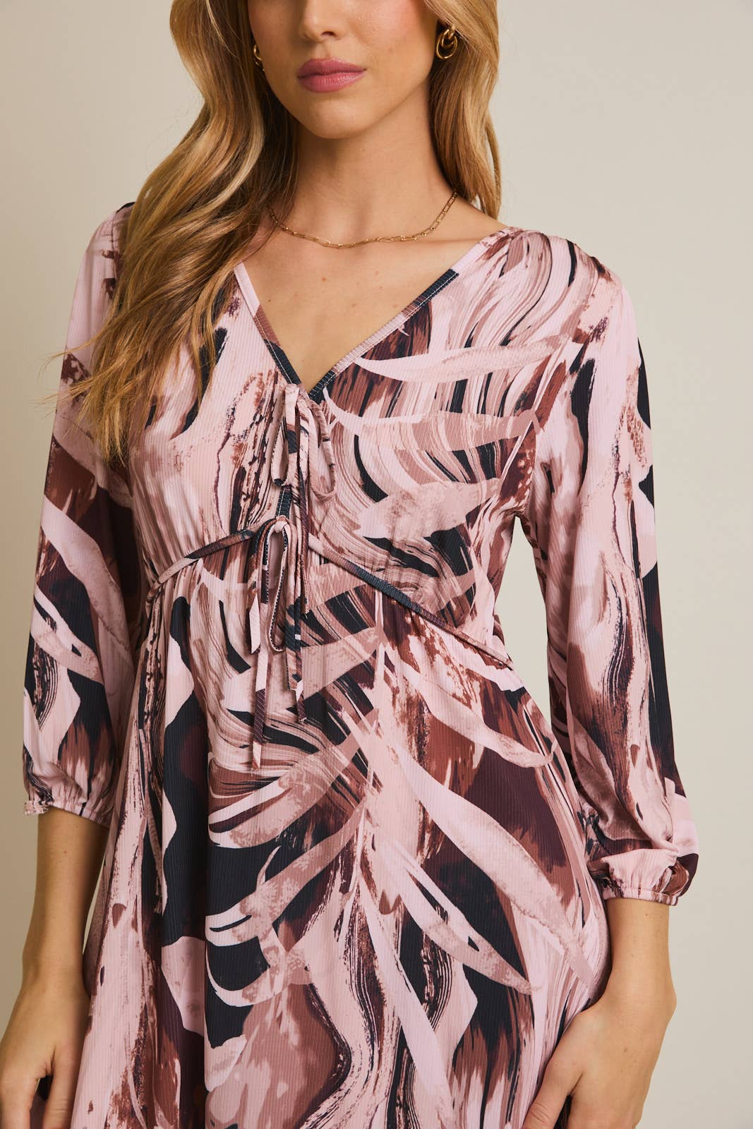 V-NECK FRONT TIE LONG SLEEVE ABSTRACT MINI DRESS for wholesale on Faire4